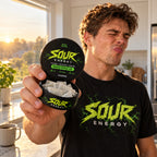 Man tasting SOUR ENERGY Green Apple Ice caffeine pouch in a sunny kitchen